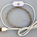 Flexible USB LED light strip bent into a curve, showing individual beads and touch control pad.