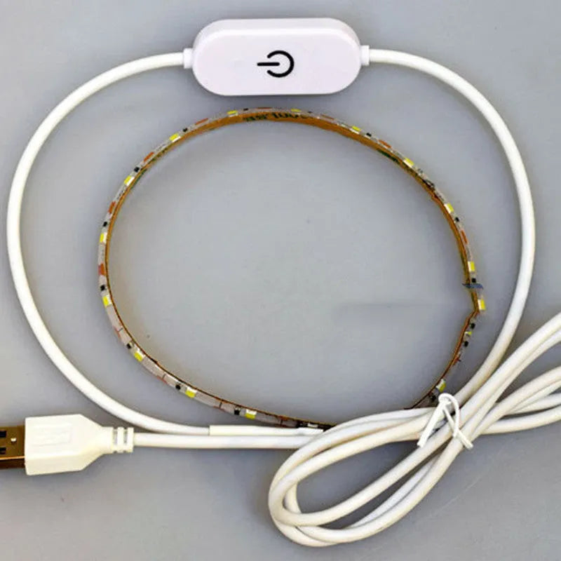 Flexible USB LED light strip bent into a curve, showing individual beads and touch control pad.