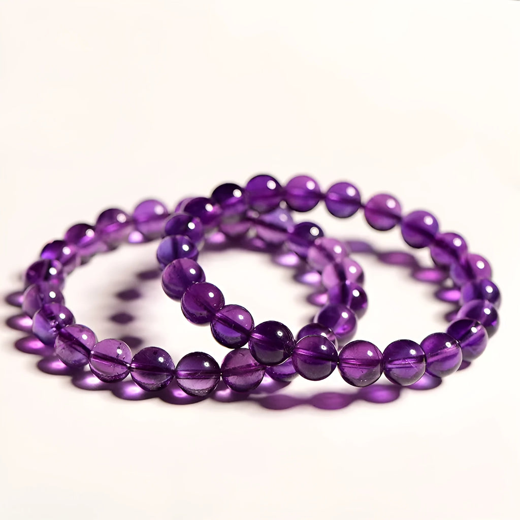 Natural Uruguay amethyst scattered bead bracelet showing purple gemstone beads on a string.