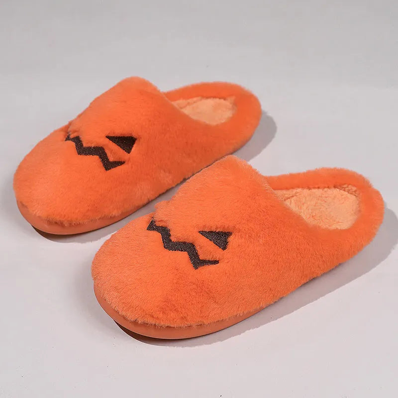 Orange plush Halloween pumpkin slippers with a coral velvet upper and non-slip sole