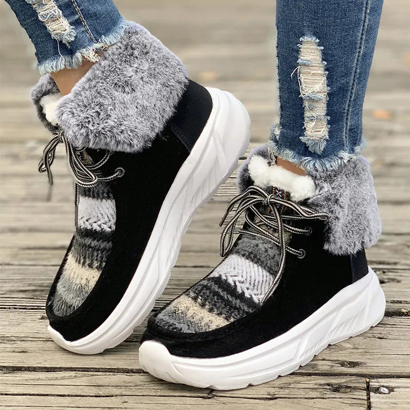 Beige women's lace-up suede snow boots with a fuzzy lining and thick rubber sole.