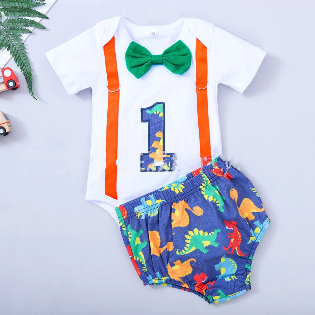 Children's blue cotton romper with shorts, bow, and dinosaur print on front