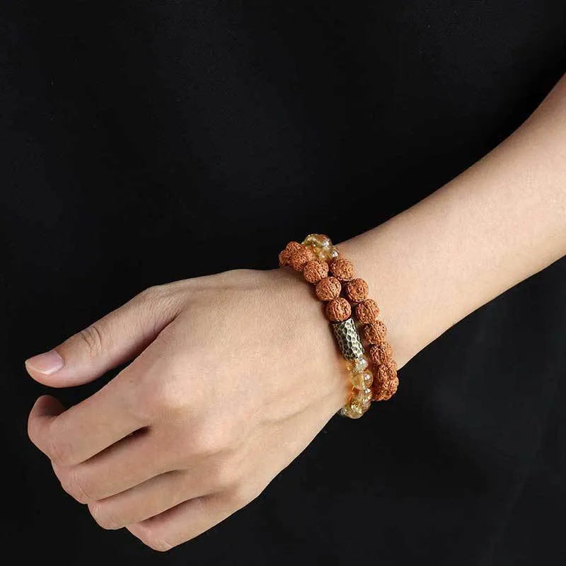 Handcrafted Barbie tan yellow tower crystal double ring bracelet on wrist.