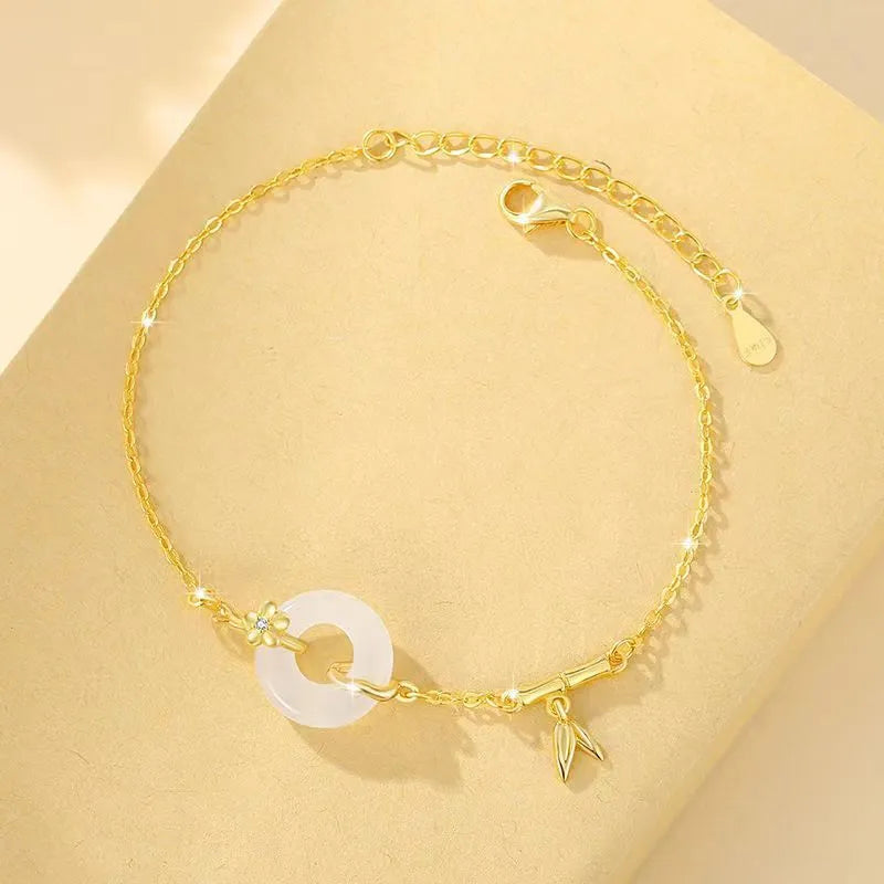 Women's silver bracelet with white chalcedony and starry sky design featuring peace buckle
