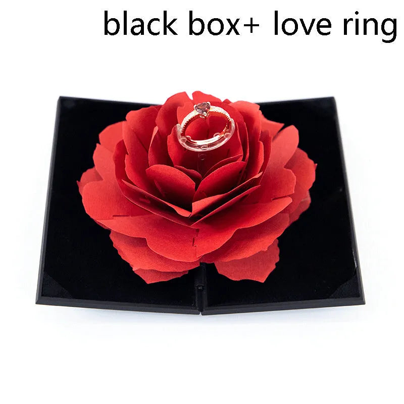 Red heart-shaped rotating plastic ring box for jewellery presentation