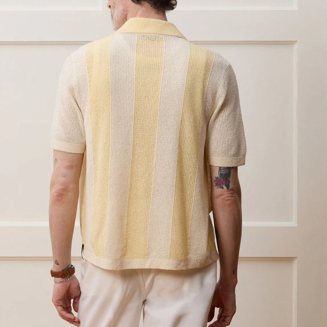 Yellow casual polo shirt with hollow-out asymmetric design and short sleeves in Tencel fabric