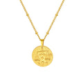Stainless steel zodiac necklace with round pendant showing embossed constellation design on a cross chain.