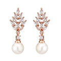 Micro inlaid zircon pearl earrings with geometric floral design in gold, platinum, or rose gold plating.