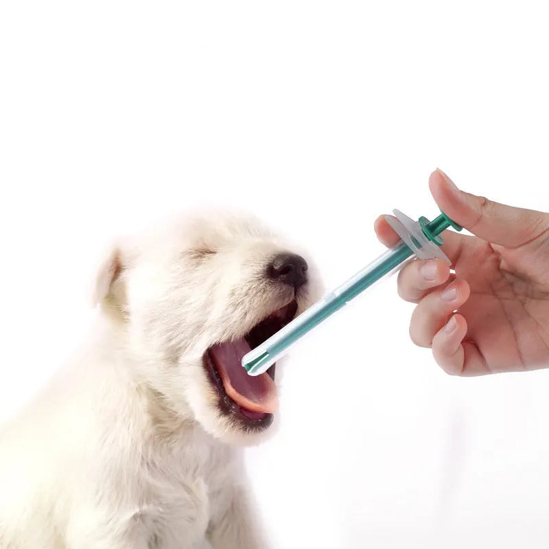 Two soft-tip pet pill shooter syringes for cats and dogs on a white background.