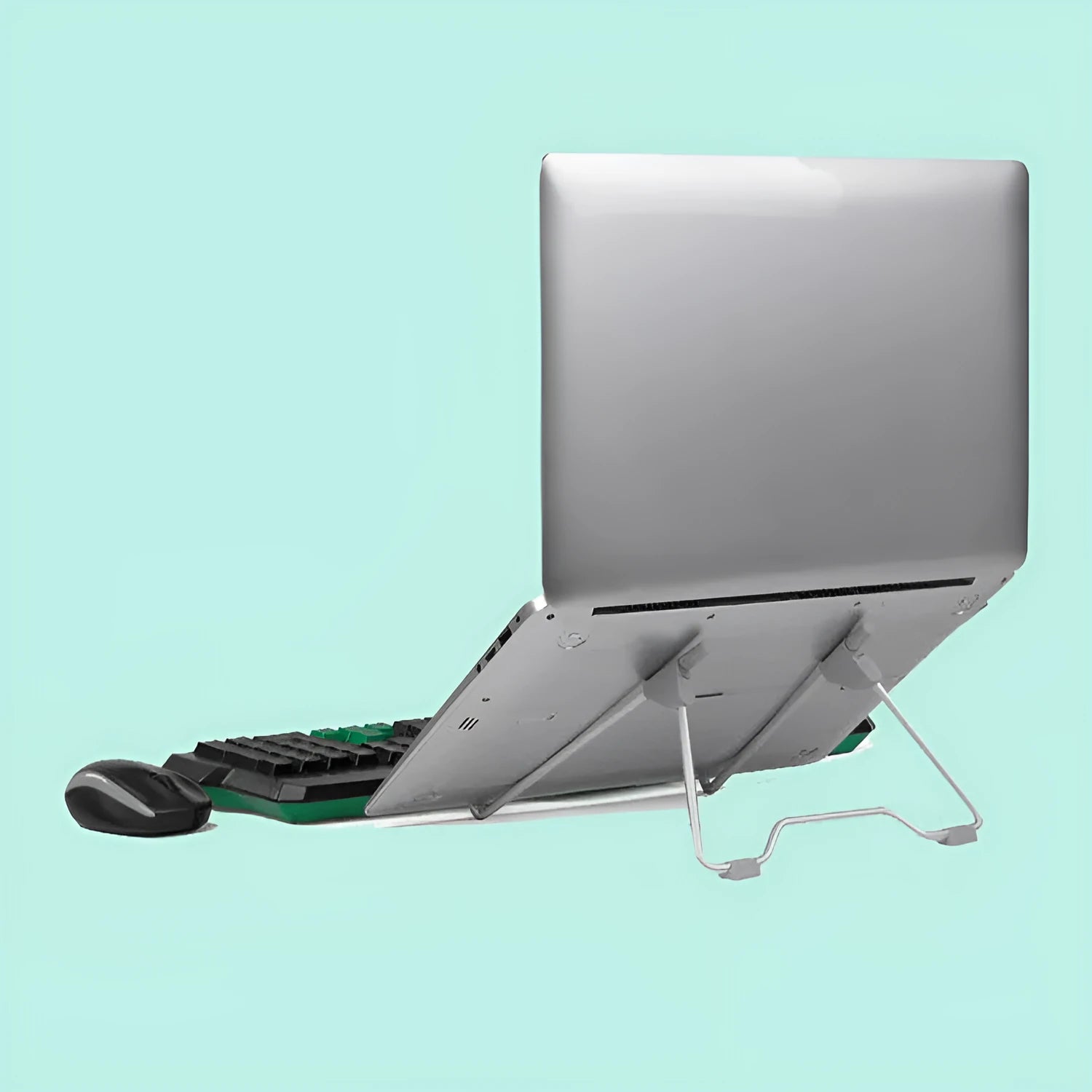 Grey aluminium alloy and plastic stand holding a mobile phone and a laptop on a desk.