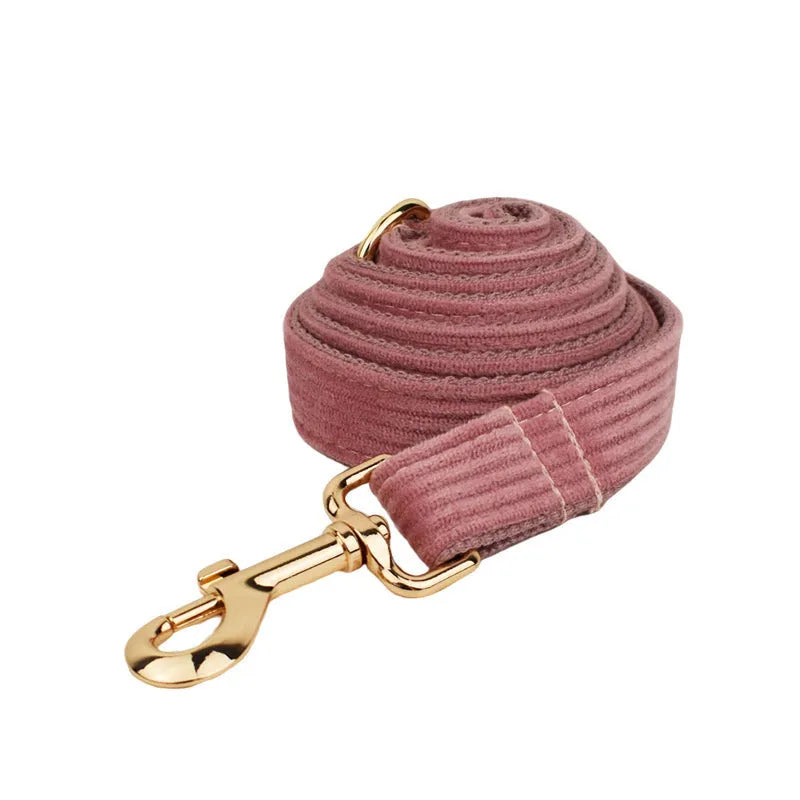 Red corduroy pet collar and matching leash set with optional bow, vest and poop bag accessories