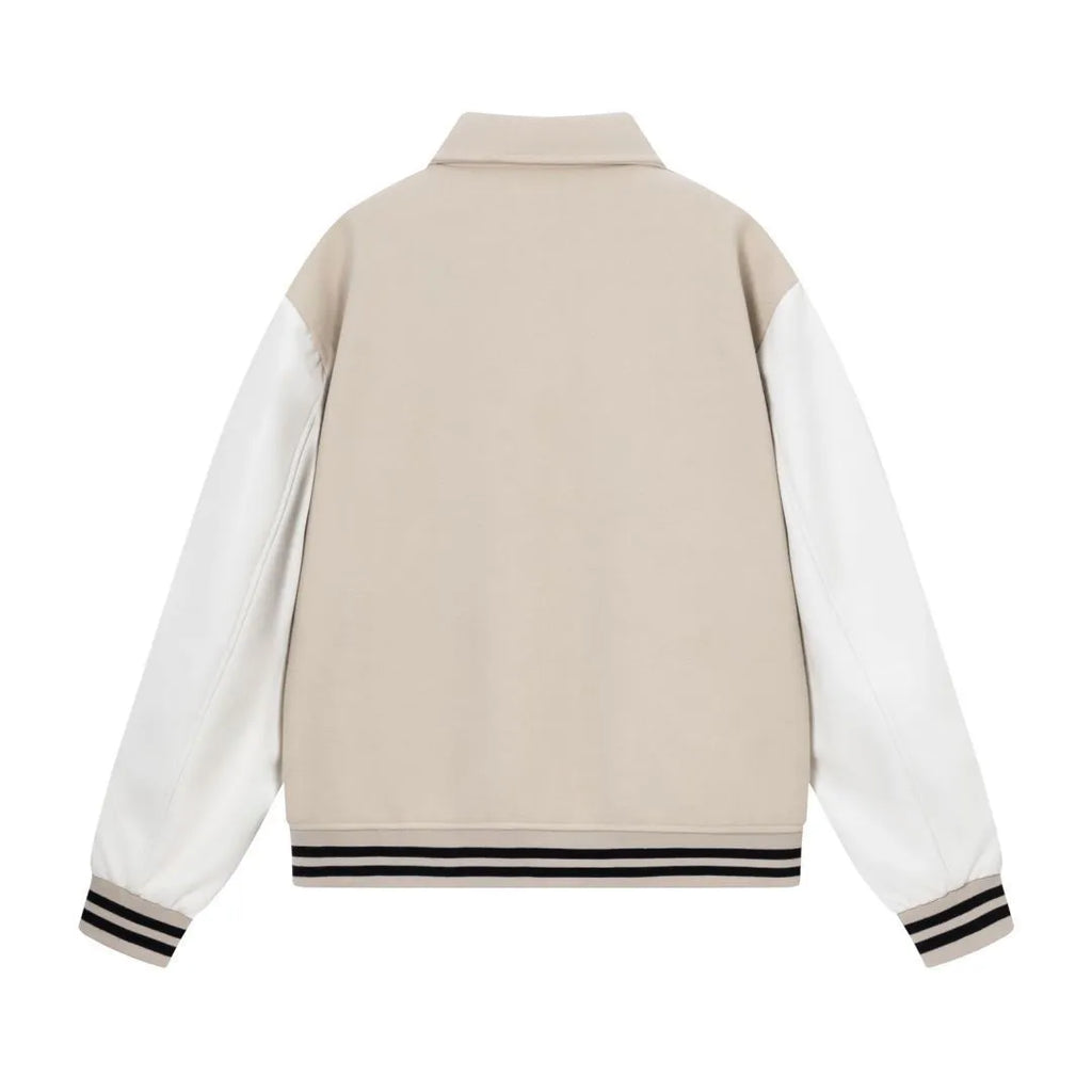 Women's apricot embroidered wool jacket with bone design detail on front.