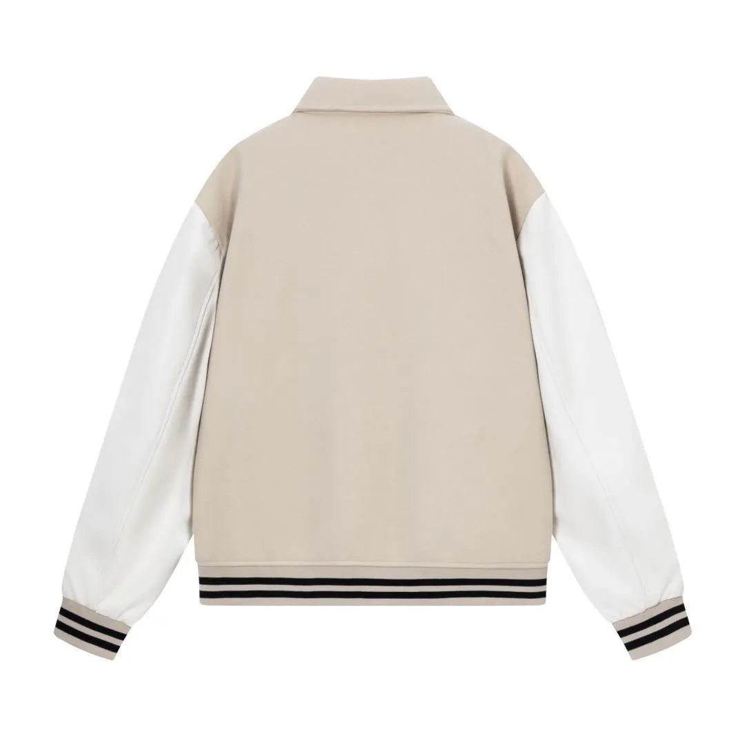 Women's apricot embroidered wool jacket with bone design detail on front.