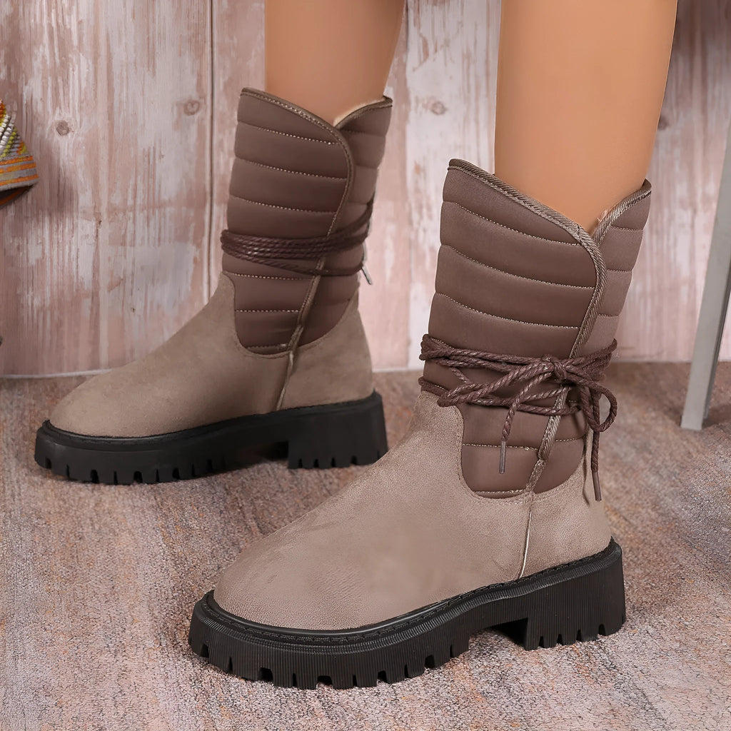 Women's black suede chunky heel snow boots with lace-up design and fleece lining.