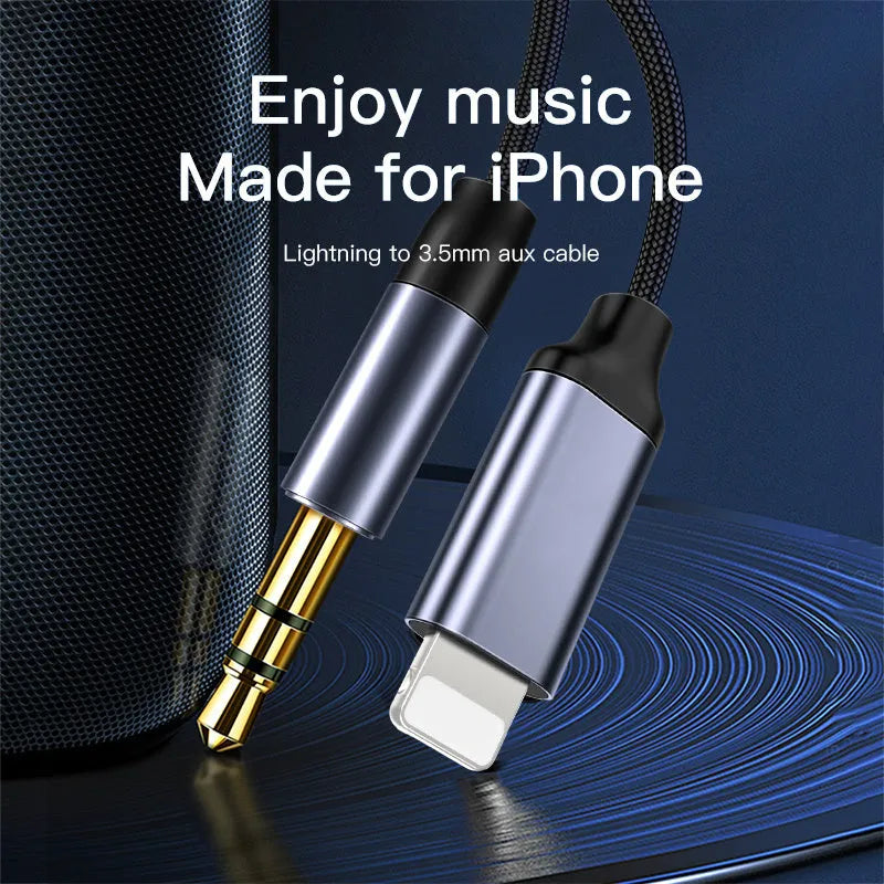 Silver nylon audio cable with 3.5mm connectors for car use on a grey background.