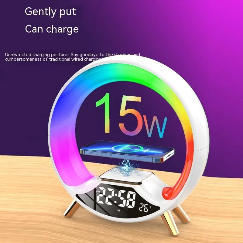 O Light three-in-one wireless charging Bluetooth speaker and night light on a bedside table.