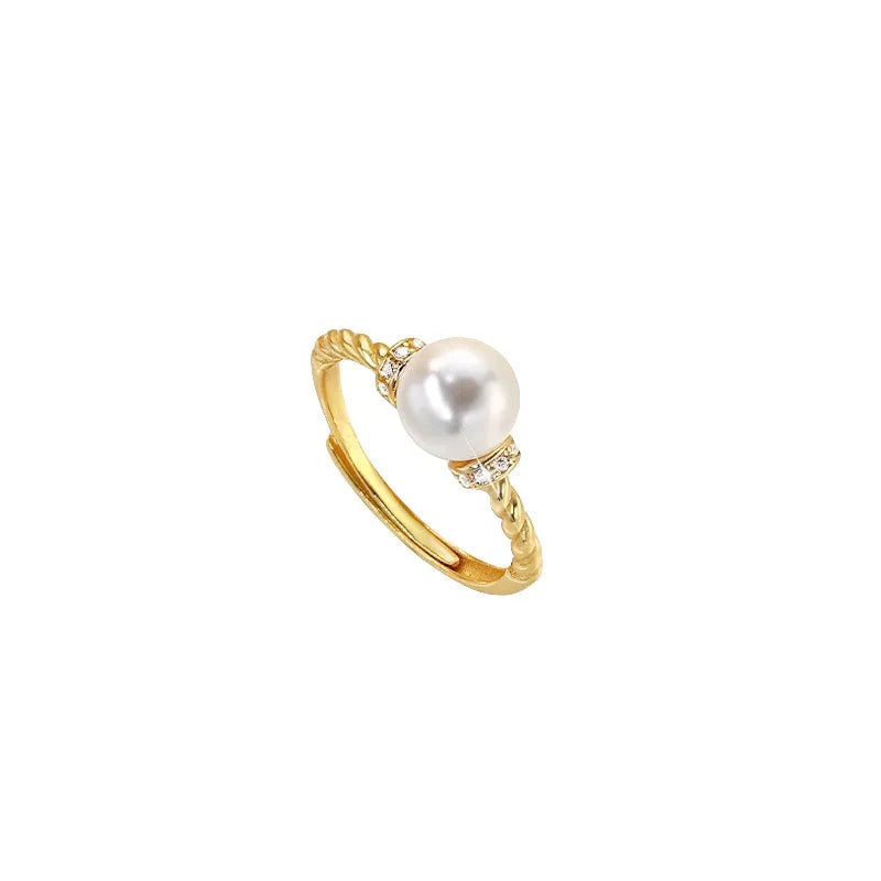 Adjustable antique twist copper ring with a geometric pearl centre in gold and silver colours.
