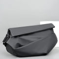 A grey medium-sized horizontal square PU crossbody bag for men, showing the shoulder strap and front zipper.