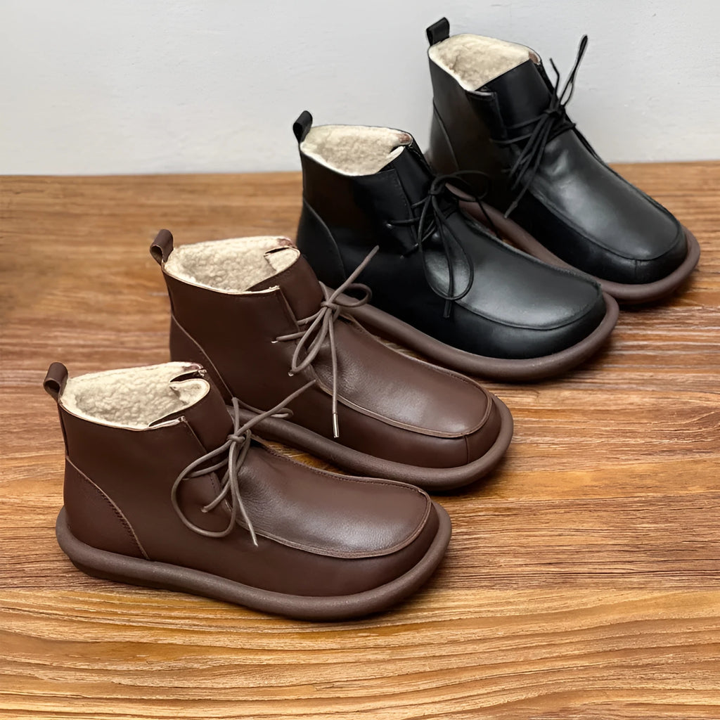 Women's cowhide boots in black and coffee colours with flat heel and round toe design