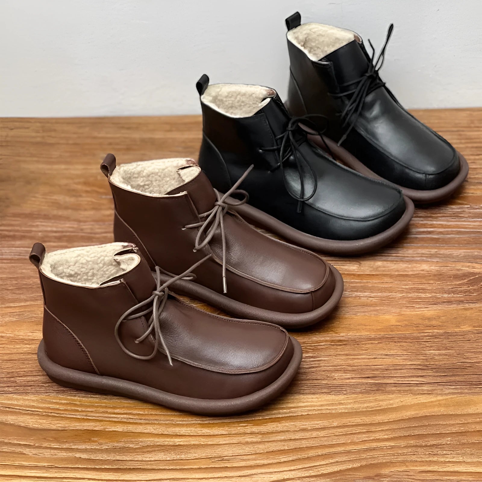 Women's cowhide boots in black and coffee colours with flat heel and round toe design