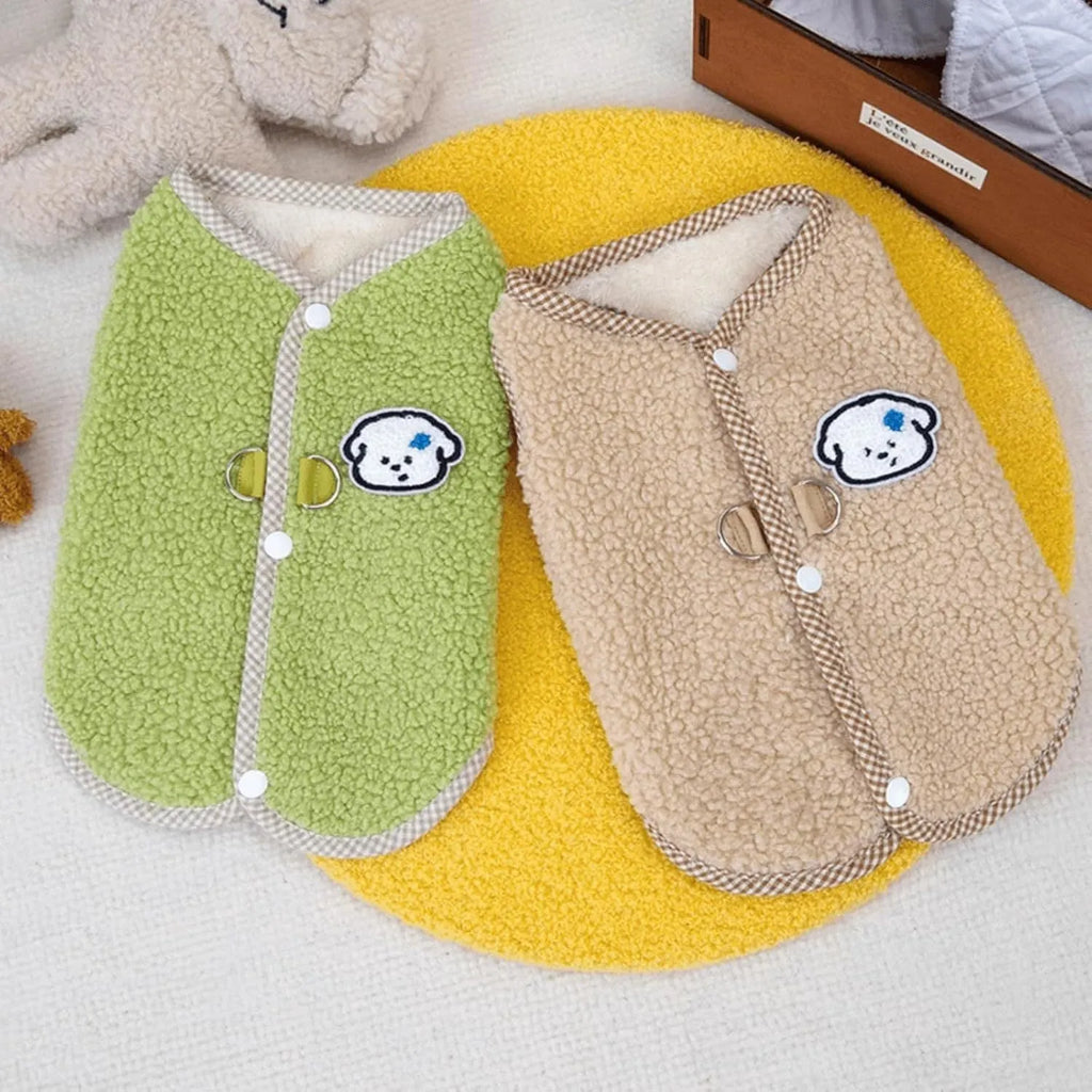 Green coral fleece dog vest with a leash ring on a small dog.