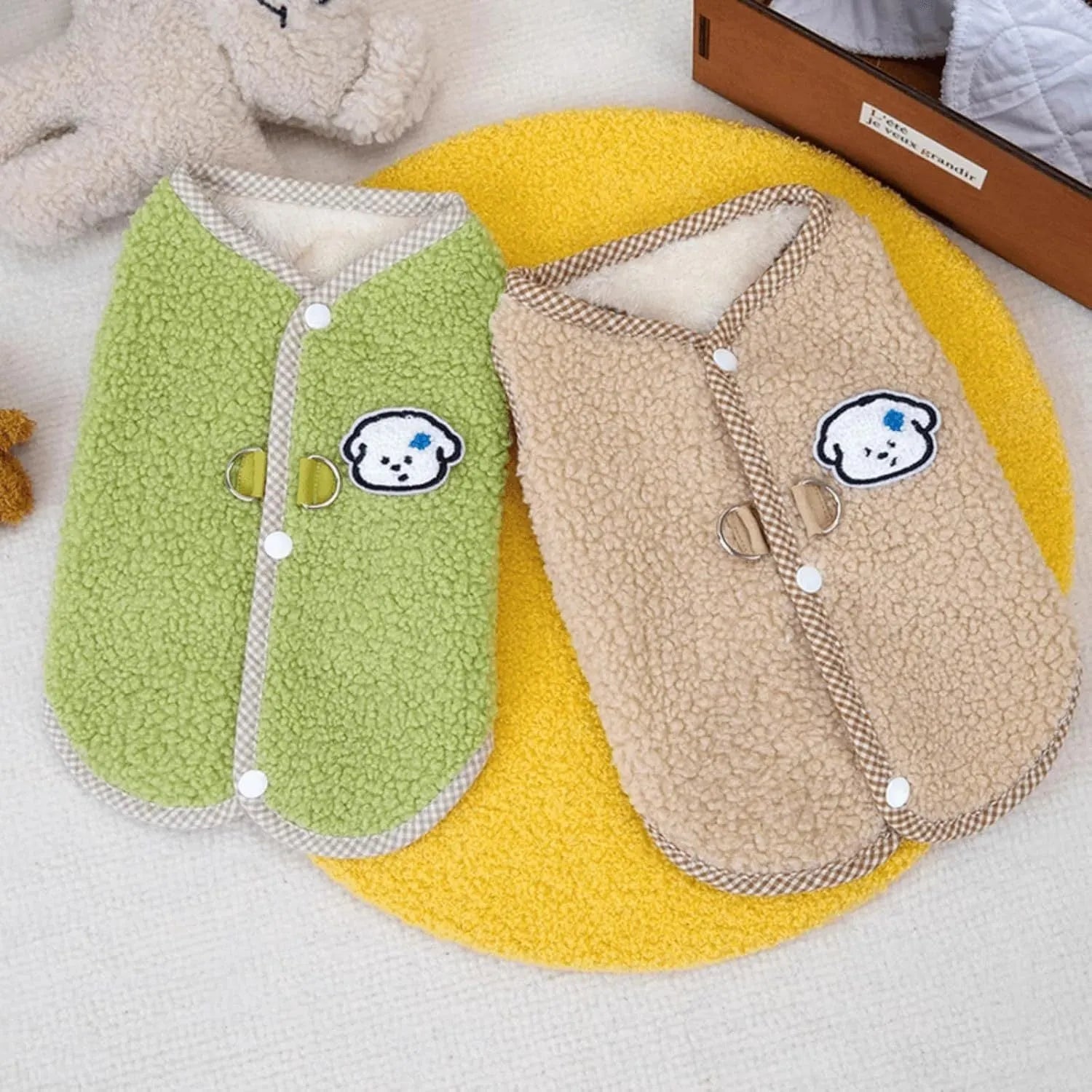 Green coral fleece dog vest with a leash ring on a small dog.