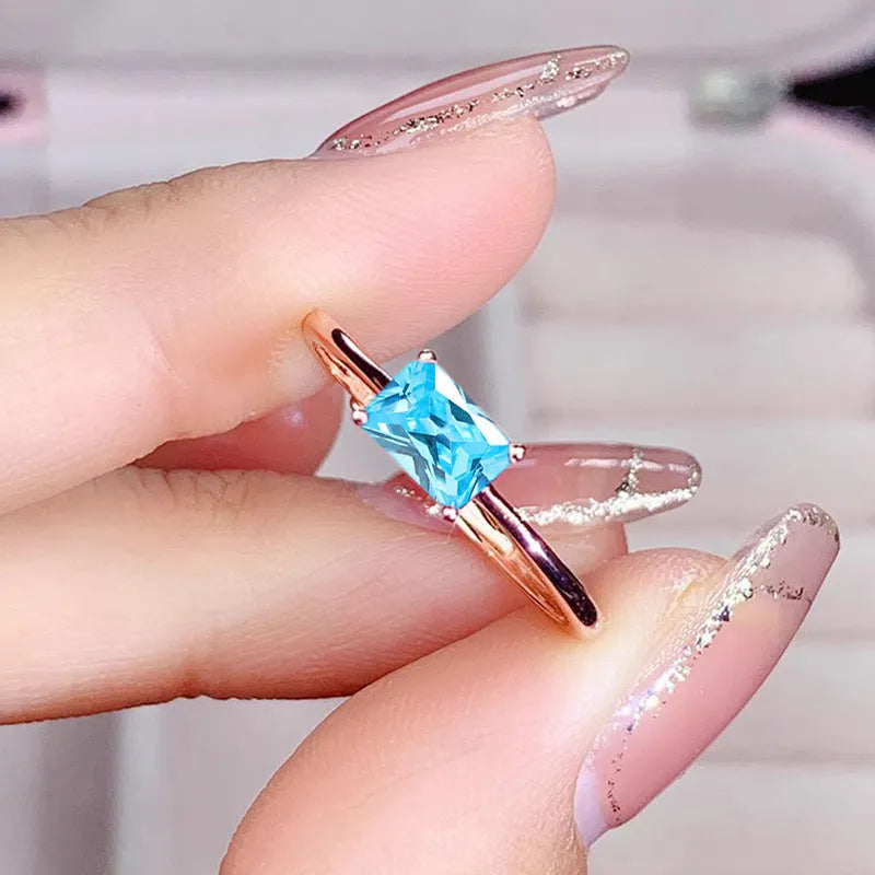 Sapphire blue geometric bracelet ring with zircon stones and heart-shaped elements on copper