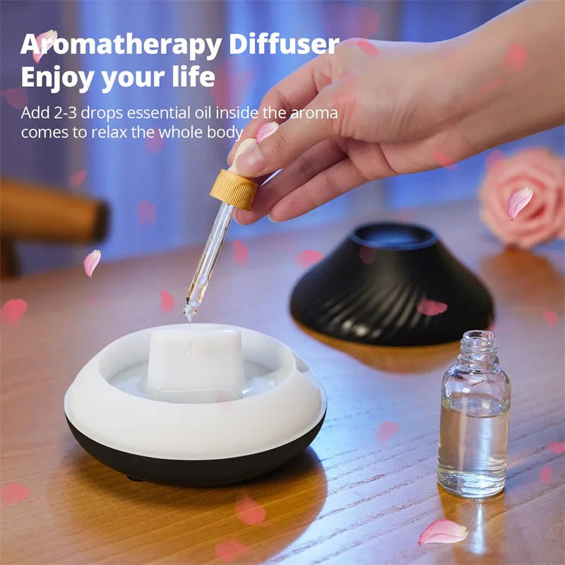Beige aromatherapy diffuser with LED flame effect lighting and mist output