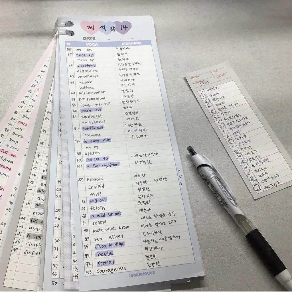 Vertical format English vocabulary notepad in B5 half size showing pink cover and double-sided printed pages