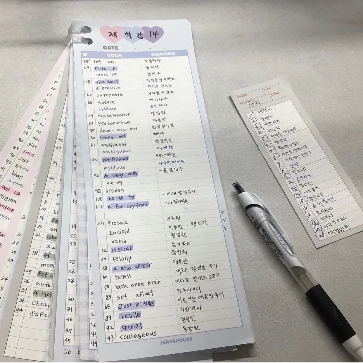 Vertical format English vocabulary notepad in B5 half size showing pink cover and double-sided printed pages