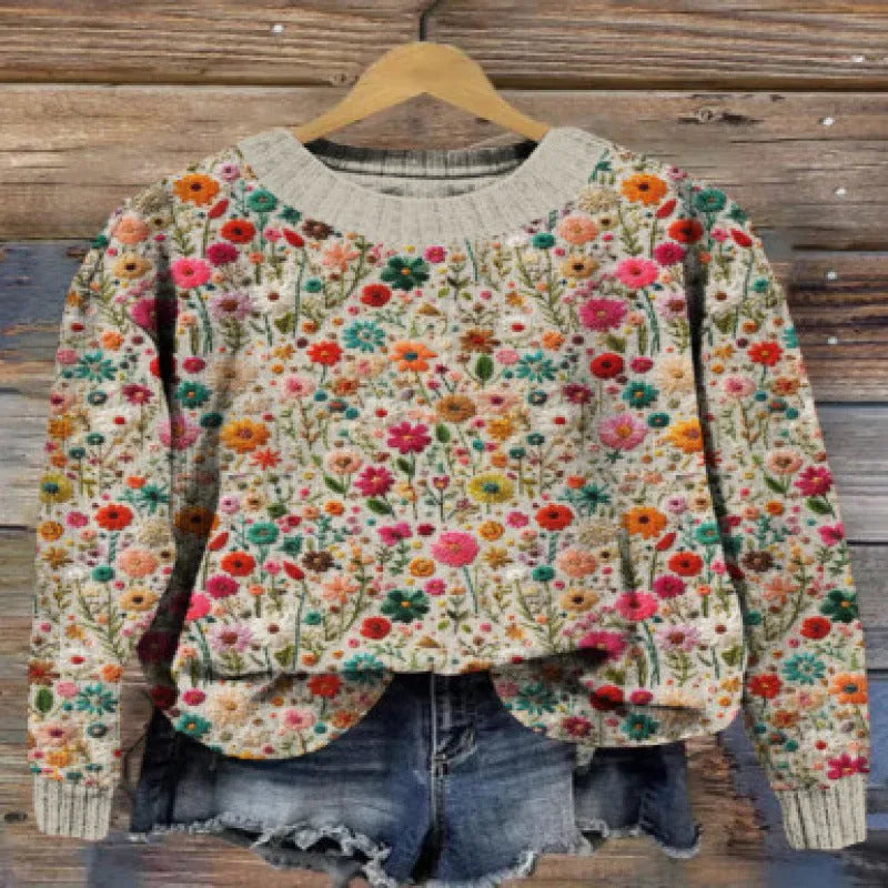 Digital printed floral pattern on a round neck polyester sweater, shown in one of multiple available colours.