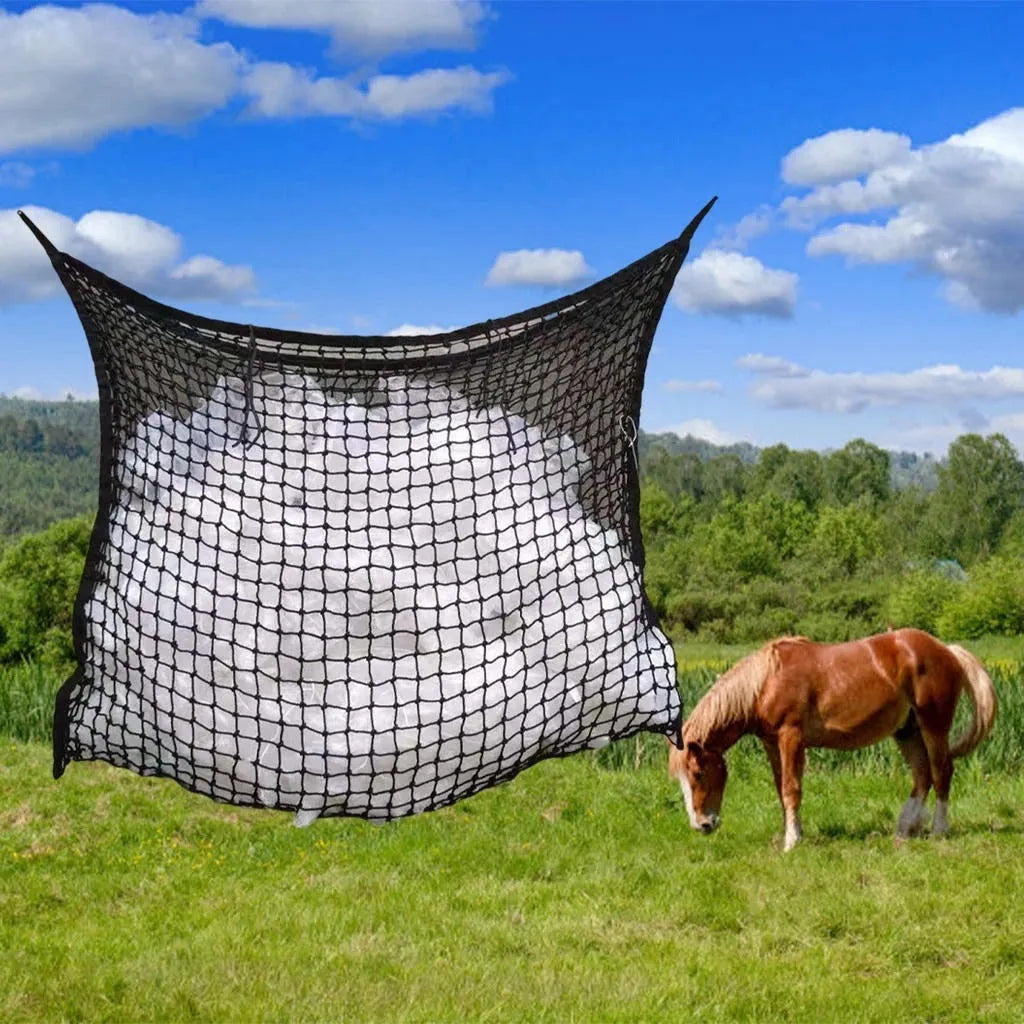 Black woven grid horse feeding bag hanging, showing its open structure and size.