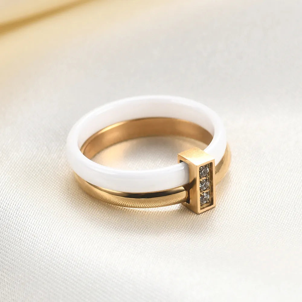 Geometric ceramic women's ring with glossy stitching and zirconium accents in steel black.