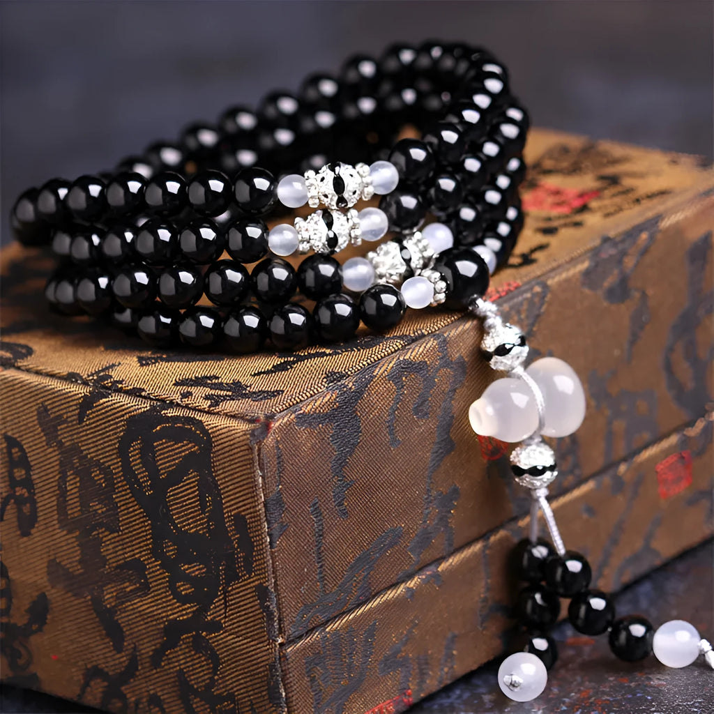 Black agate 108 bead unisex geometric bracelet with number elements.