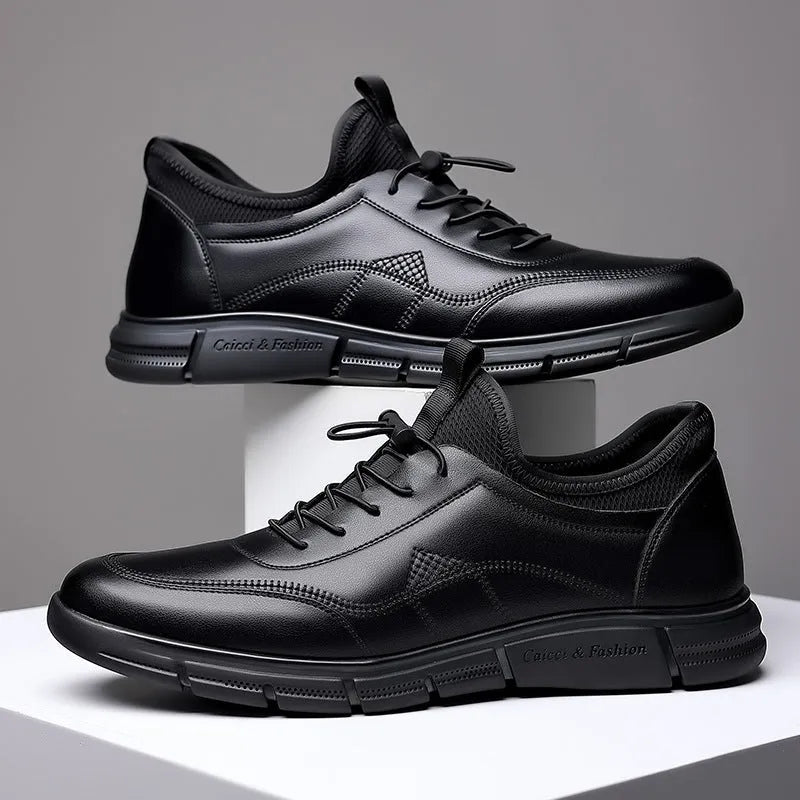 Black men's casual leather shoes with round toe and square low heel on a rubber sole.
