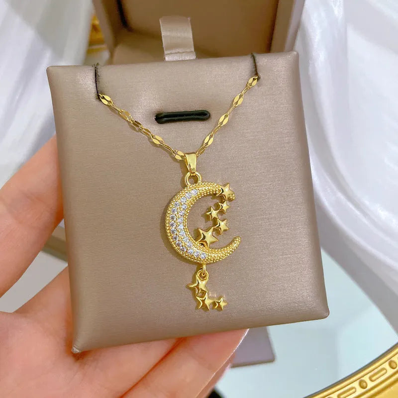 Geometric moon pendant necklace on a stainless steel chain with a copper accent.