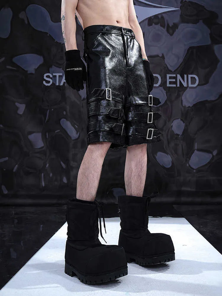 Men's black PU leather casual shorts with metal ring detail on a medium-low waistband.