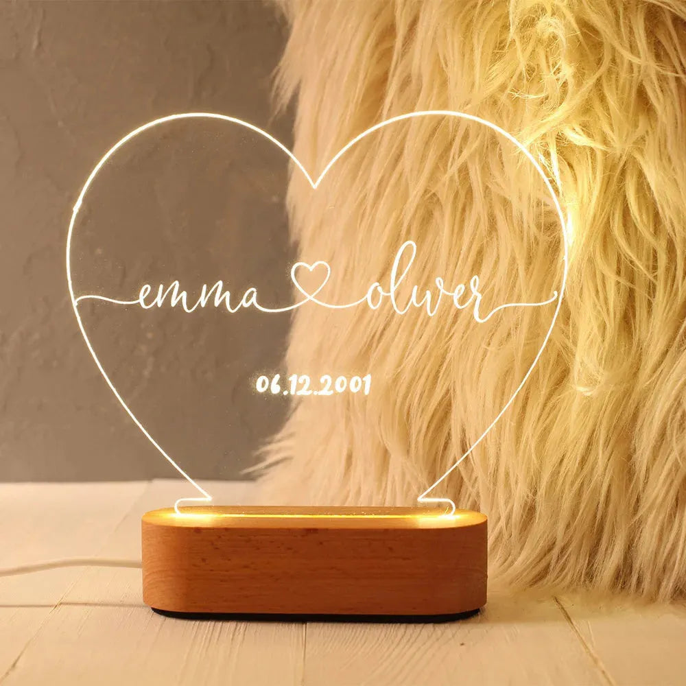 Personalised acrylic night light displaying custom names and date for Valentine's Day gift.