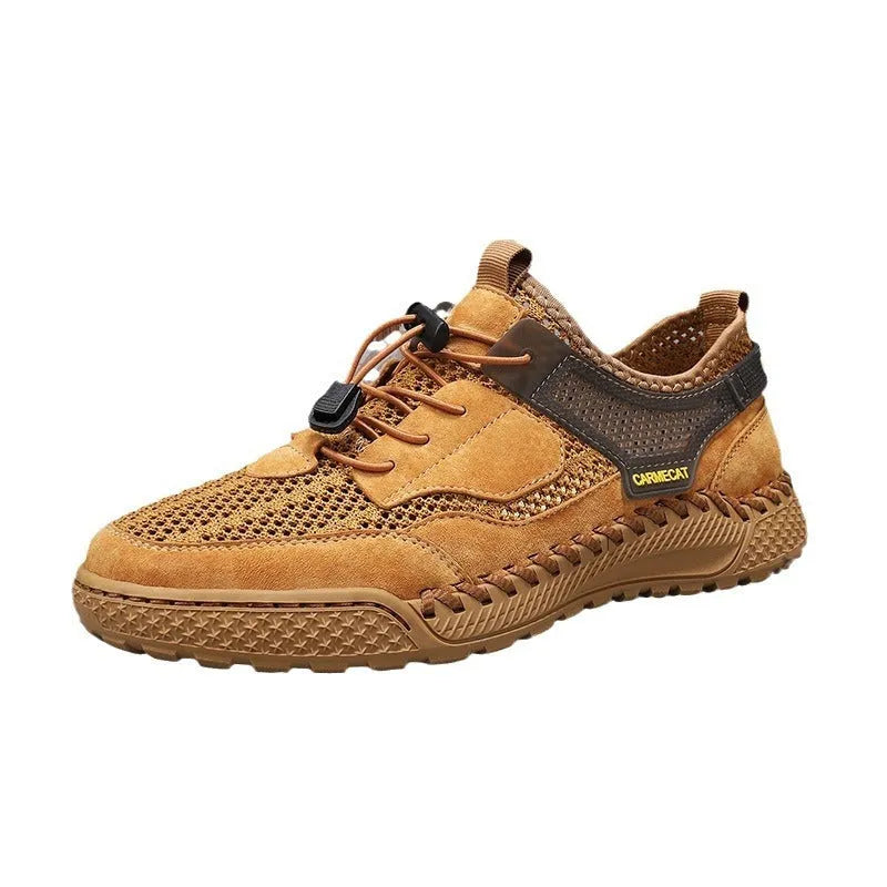 Men's grey suede low-top trainers with elastic band and hand-stitched rubber sole.