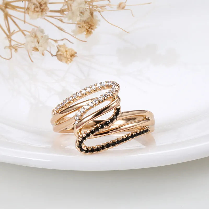 Fashion personality ring with micro-inlaid zircon detailing on copper with electroplated WK2230 finish.