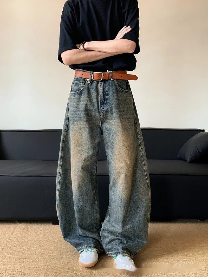 Men's retro blue jeans with distressed machete detailing and slimming wide-leg cut on mid waist design