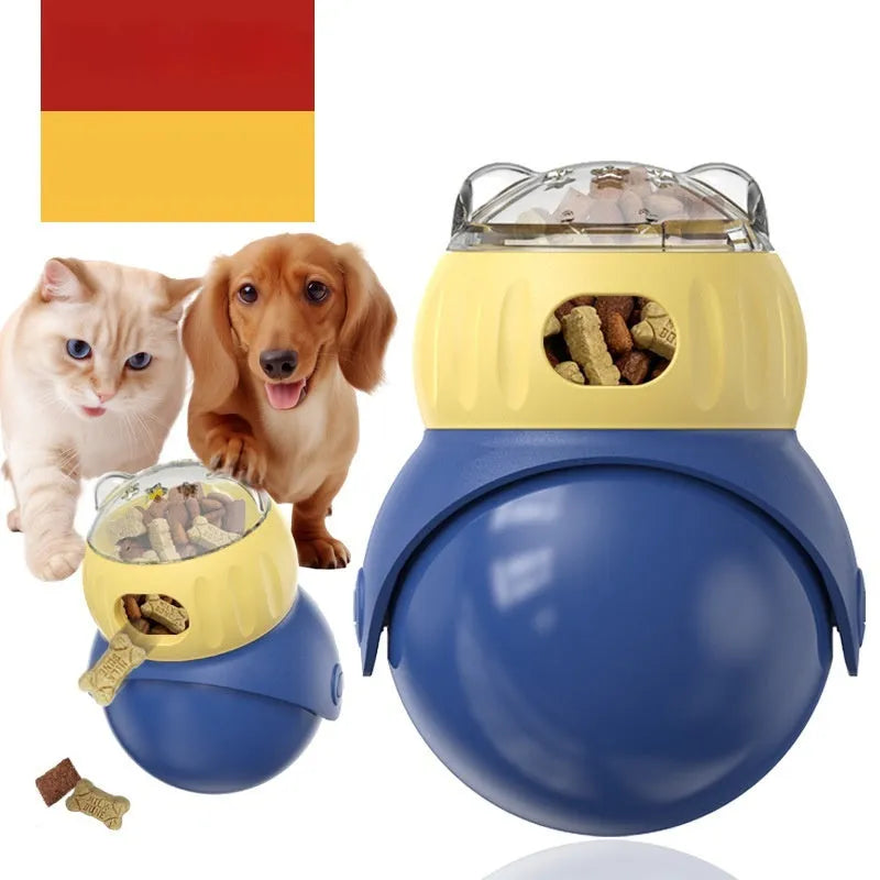 Yellow and blue plastic owl-shaped tumbler puzzle feeder cat toy on a flat surface.