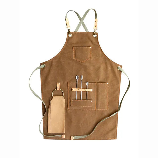 Canvas apron with cross-strap design in camel colour for café work and baking