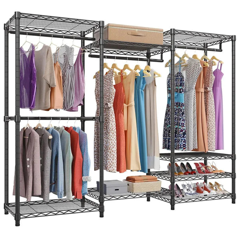 Black floor standing metal clothes storage rack with garments hanging