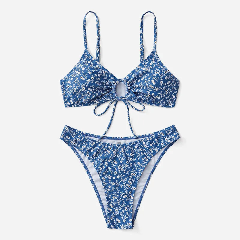 Blue women's swimsuit three-piece set with halter top and shorts on a mannequin.