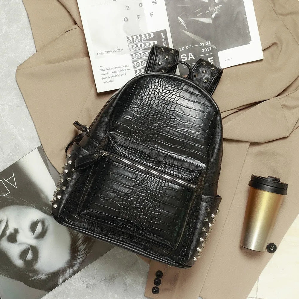 Black waterproof fashion computer bag with oil wax leather finish and rivet detailing showing interior compartments