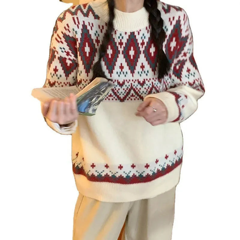 Red and white striped women's loose long-sleeve pullover knitted top on a hanger.