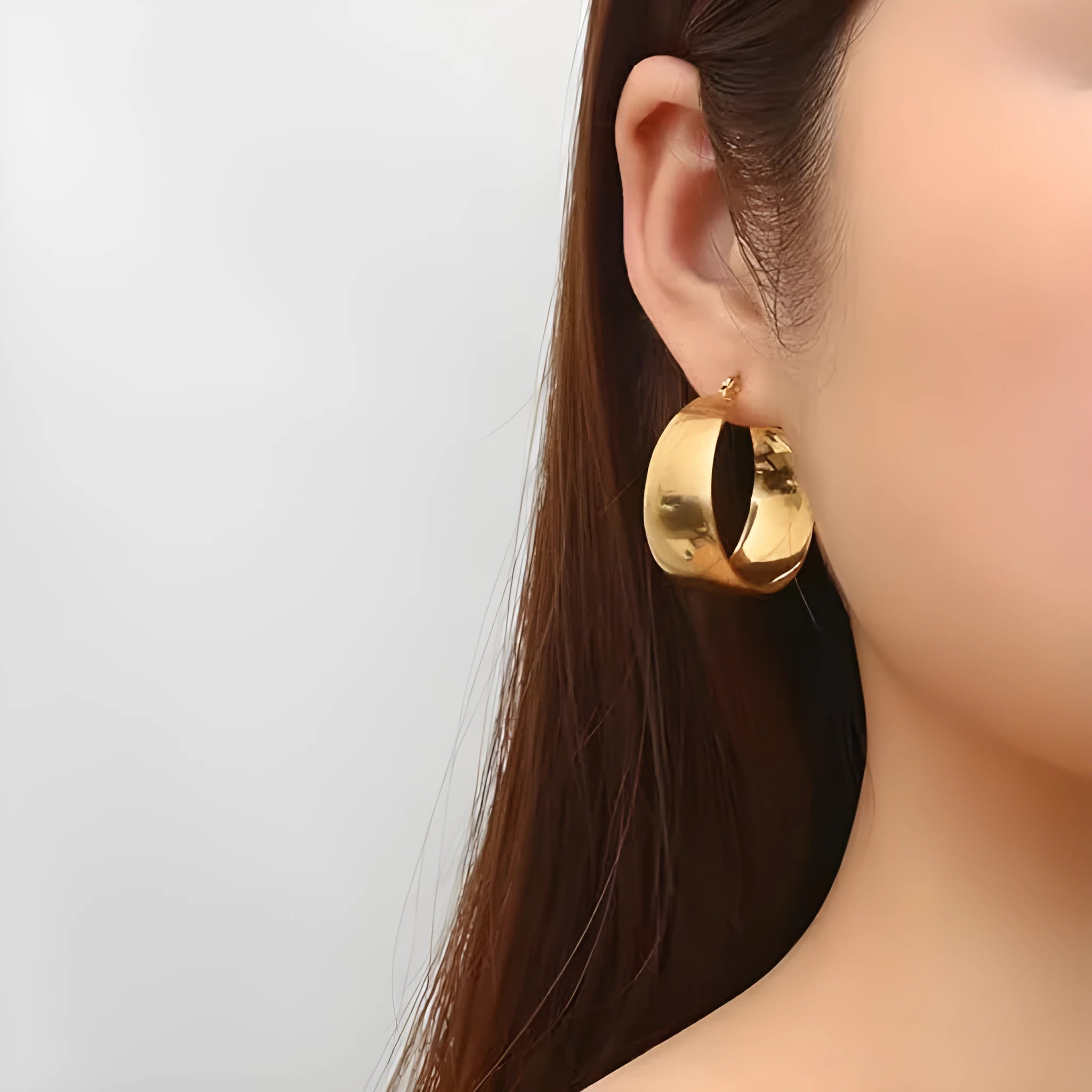 Widened curved stainless steel earrings in gold or steel colour with 25mm and 30mm size options