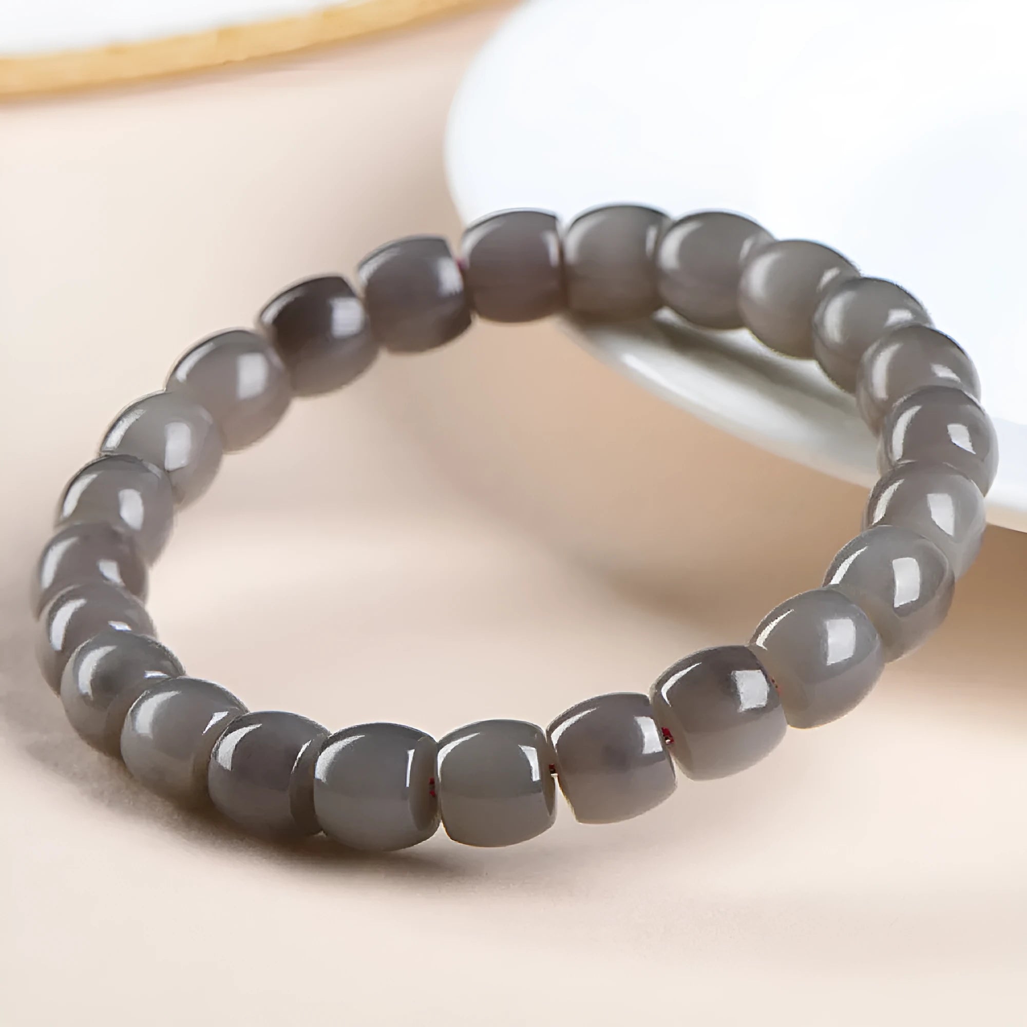 Natural Smokey Violet Hetian Jade straight cut bracelet with polished 8x9mm beads on an elasticated band.