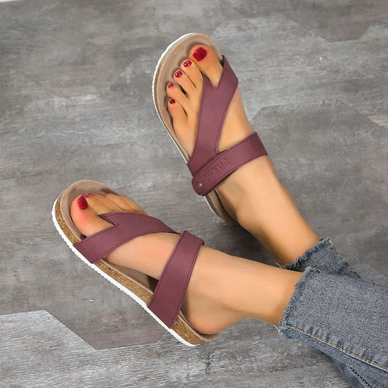 Flat toe ring thick-soled flip-flops in a solid colour on a white background.